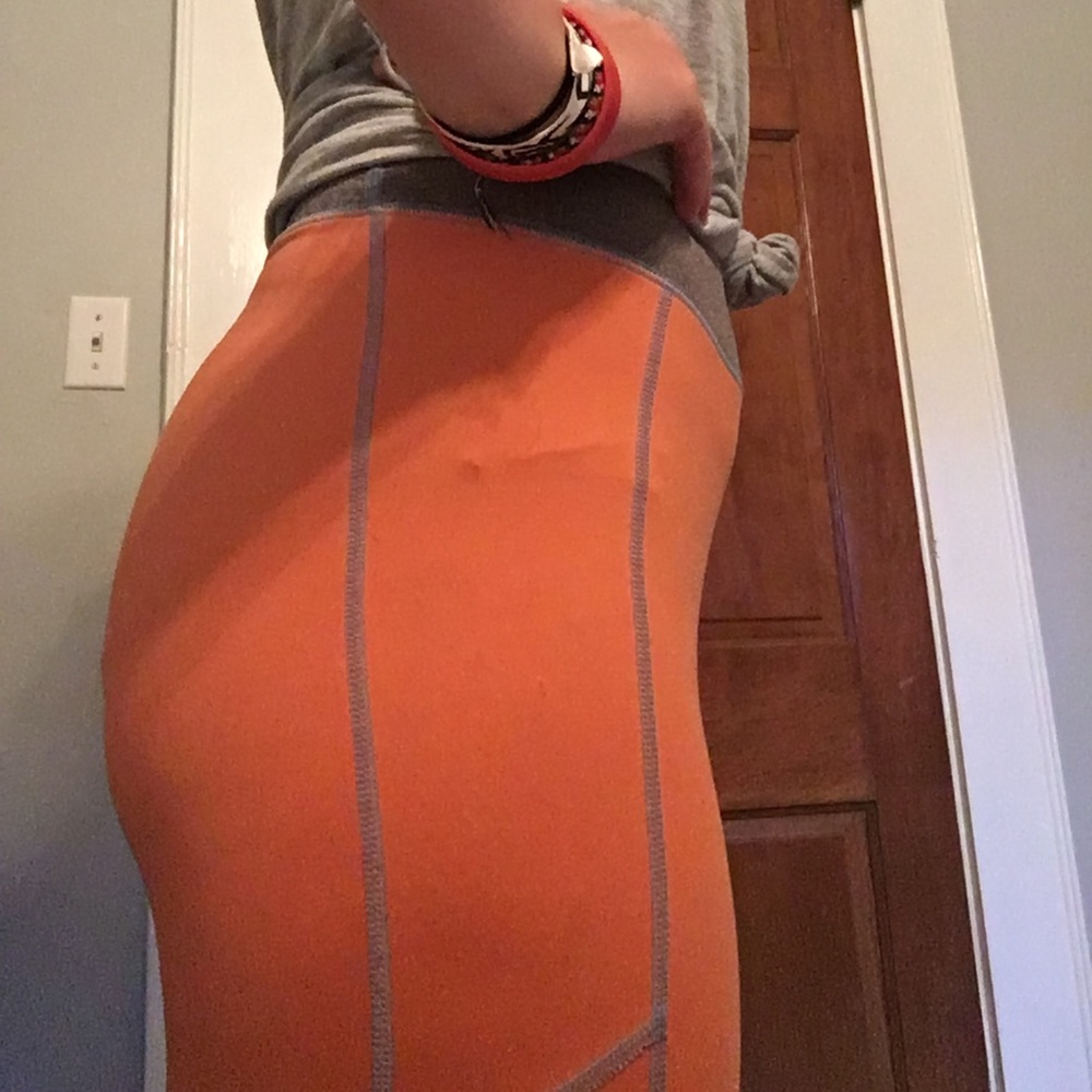 Orange athletic pants.